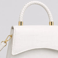Sac Agathe blanc, détail de l’anse et des finitions dorées
