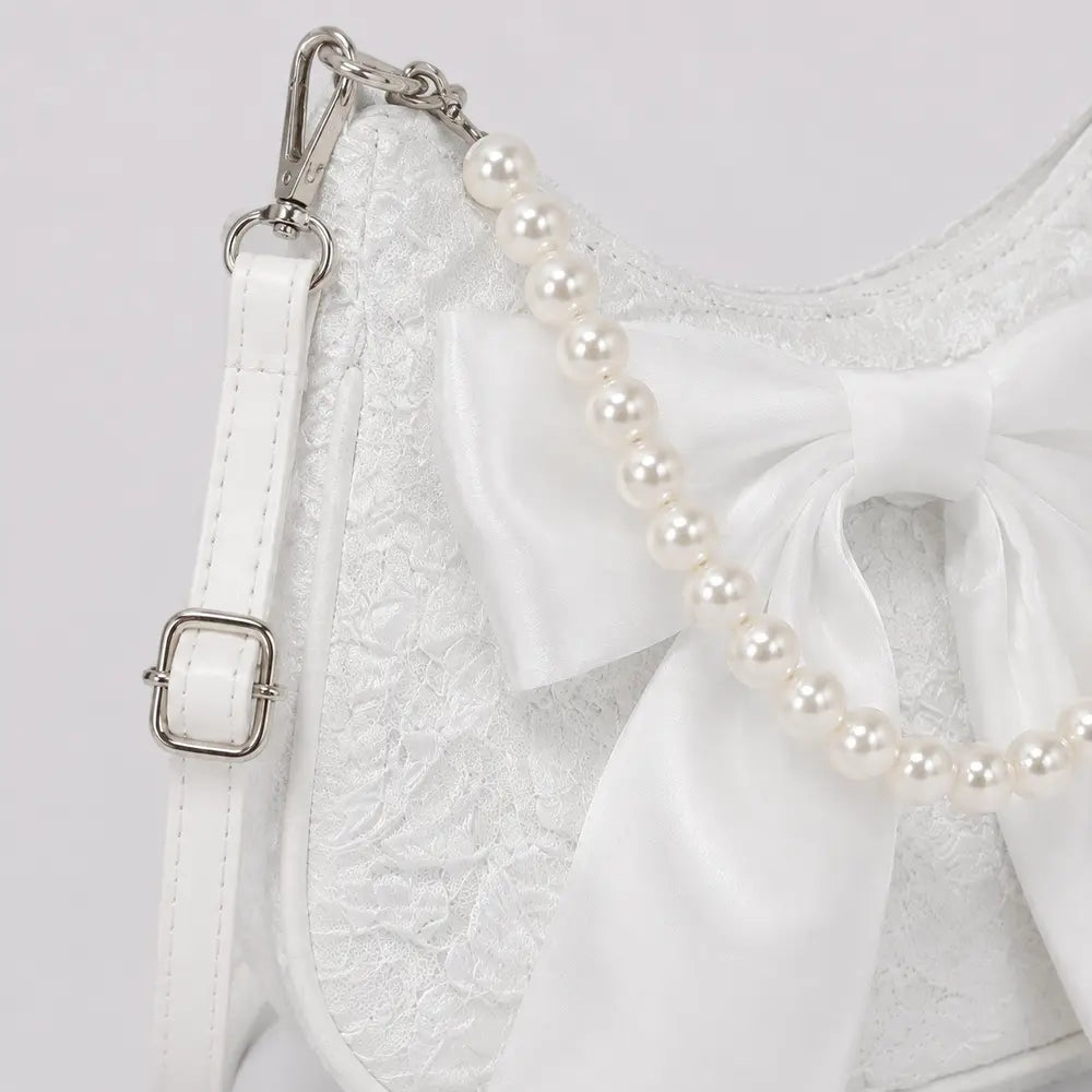 Sac Célestine blanc, détail du nœud et de la poignée perlée
