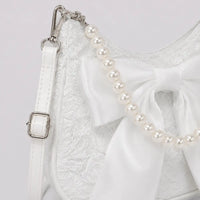 Sac Célestine blanc, détail du nœud et de la poignée perlée