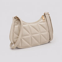 Petit sac à main beige Victoire, vue trois-quarts sur fond studio neutre