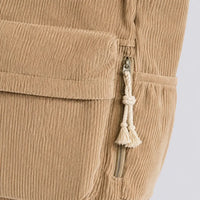Sac à main Beige — Cléophée, gros plan sur le zip de poche et le pompon corde