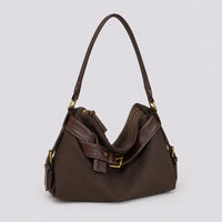 Sac à main marron foncé Bertille, vue trois-quarts sur fond studio neutre