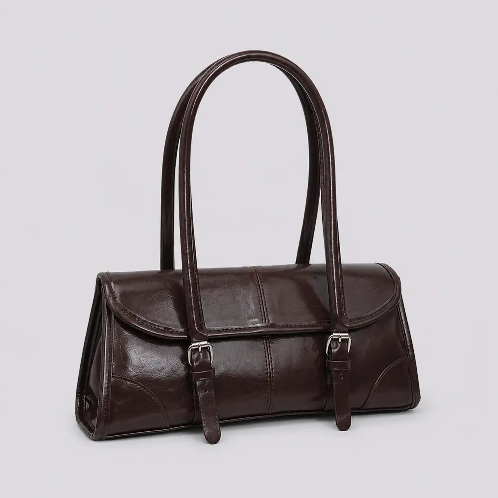 Sac à main marron foncé Nine, vue trois-quarts sur fond studio neutre