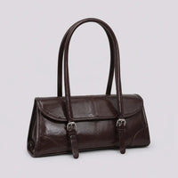 Sac à main marron foncé Nine, vue trois-quarts sur fond studio neutre