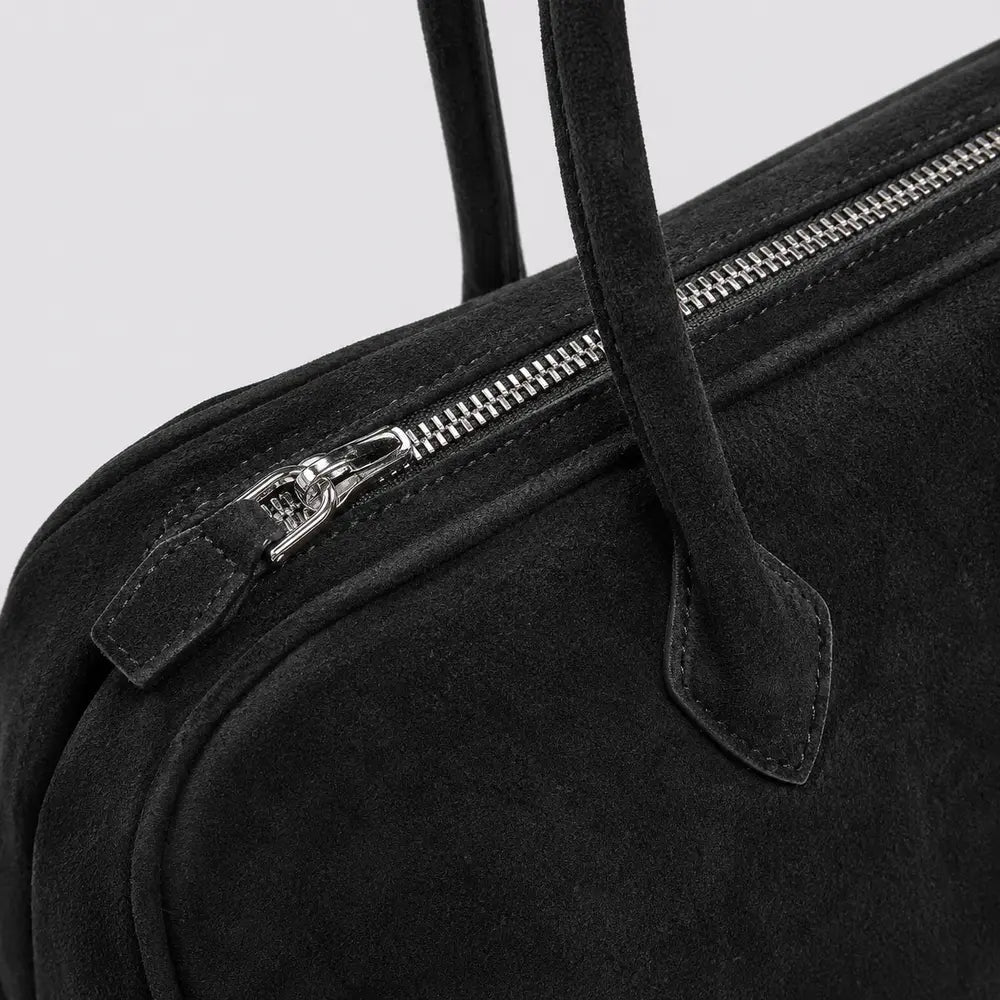 Sac à main Noir — Ombeline, gros plan sur le zip et l’attache d’anse