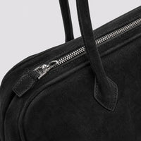 Sac à main Noir — Ombeline, gros plan sur le zip et l’attache d’anse